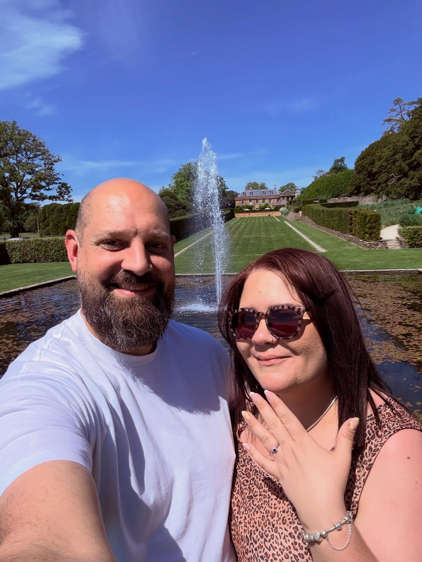 The engagement selfie by the fountain, ring on show